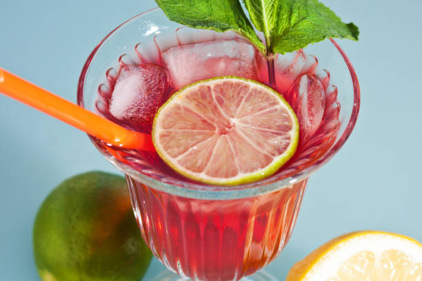 istock Cocktail with orange, Cherry, pomegranate juice in a glass 687037594