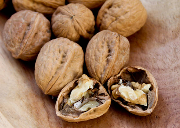 A group of broken walnuts stock photo