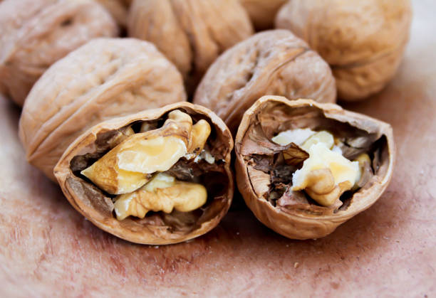 A group of broken walnuts stock photo