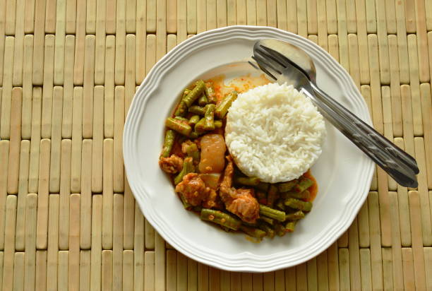 istock spicy stir fried yard long bean and fat pork curry with rice 687067228