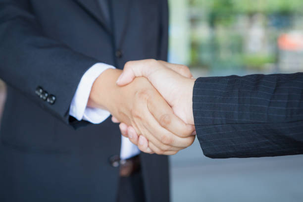 istock Close up view of business partnership handshake concept. 687067408