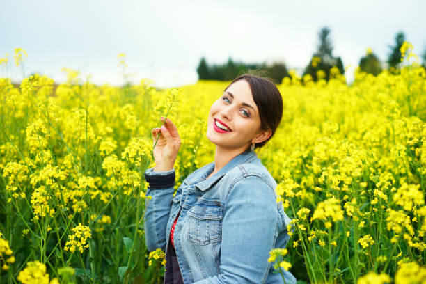 istock A young caucasian woman in rapeseed field 687067950
