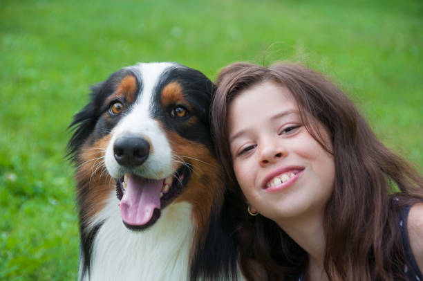 istock Smiling girl with her dog 687071264