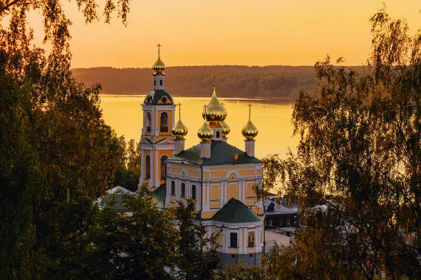 The sunset landscape of the Russian Orthodox Church, standing on the banks of the Volga.