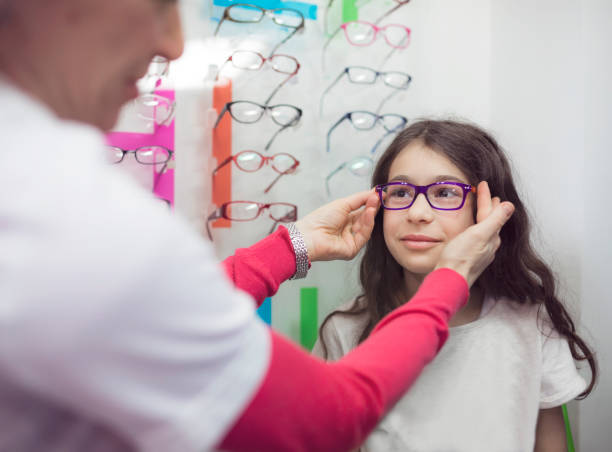 istock Little girl trying on optic glasses 687078766