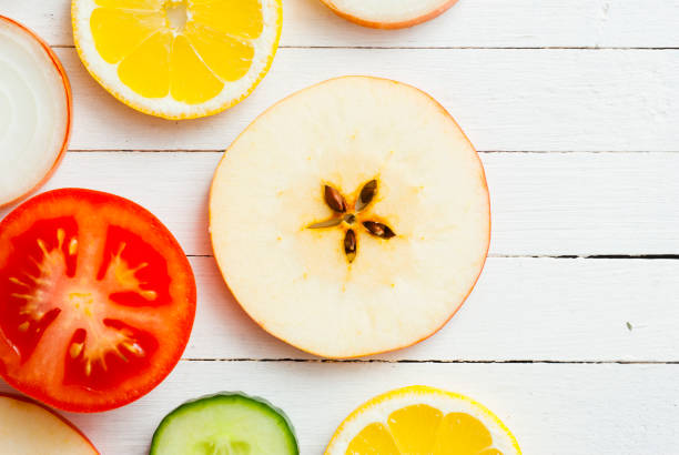 fruit circles, top view - isolated on red still life tomato lemon imagens e fotografias de stock