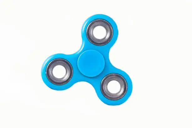 Fidget Spinner in white isolated background for stress release during work