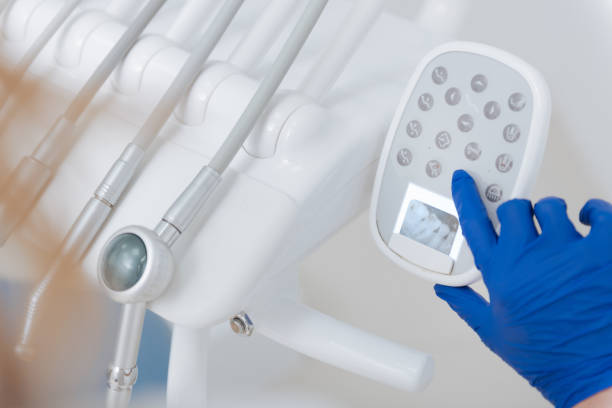 istock Busy trained dentist setting up her equipment 687097282
