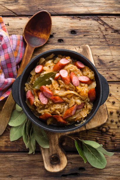 istock Cabbage braised with sausages, sauerkraut. German cuisine. 687100292
