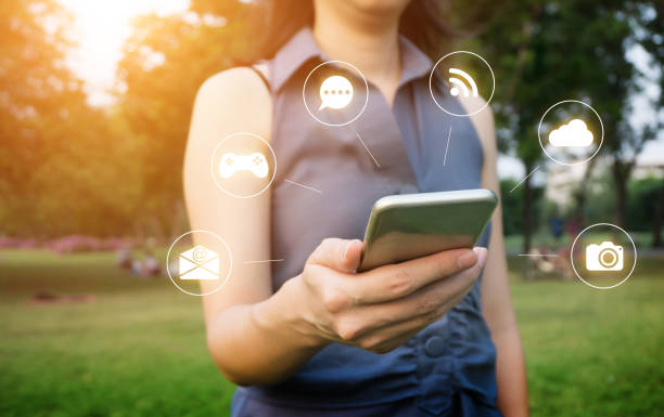 istock hand of Young woman touching smartphone 687102016