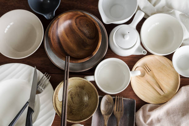 istock Many empty dishes and plates on wooden background 687102090