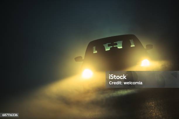 Car Driving In The Fog Stock Photo - Download Image Now - Headlight, Night, Car