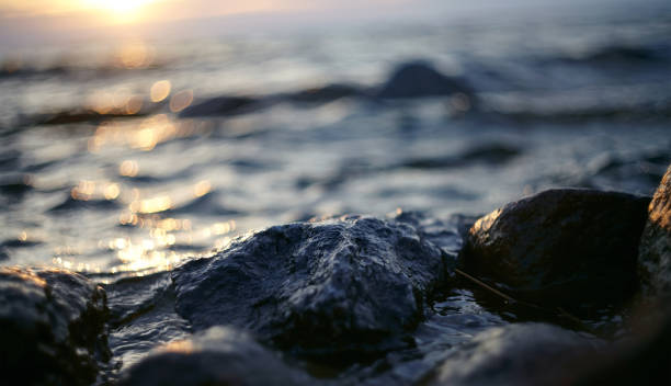 istock Patches of light from the sunset sun on waves 687117216