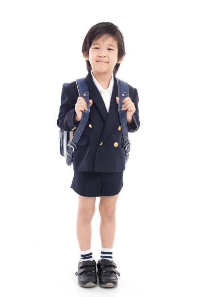 istock Asian child in school uniform with blue school bag 687120102