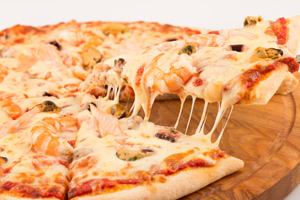 istock Pizza with seafood, mozzarella, mussels, octopus, squid, salmon, shrimp 687123458