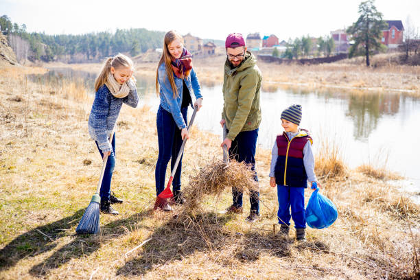 istock Family is cleaning outside 687124346