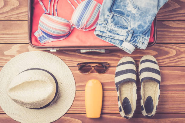 istock Open bag with beach accessories and clothes 687124758
