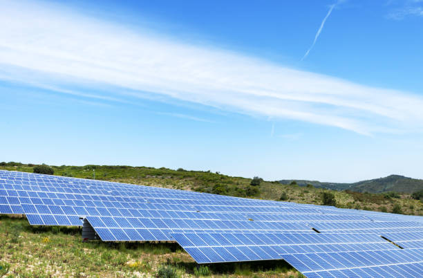 istock solar panels with the sunny sky. Blue solar panels 687127170