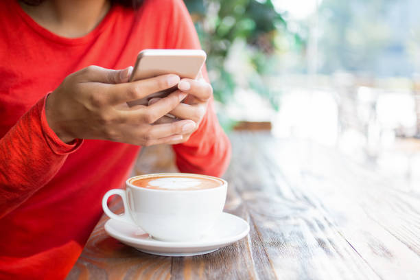istock Close-up of unrecognizable woman using smartphone 687128092