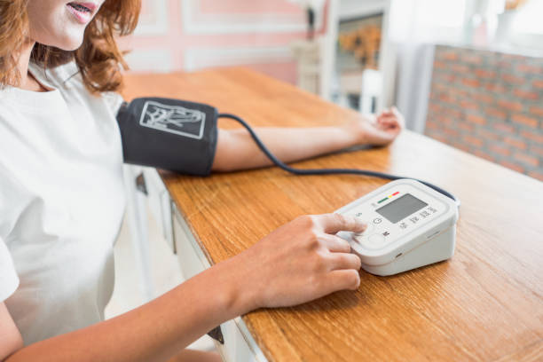 istock Woman measures her blood pressure. 687138830