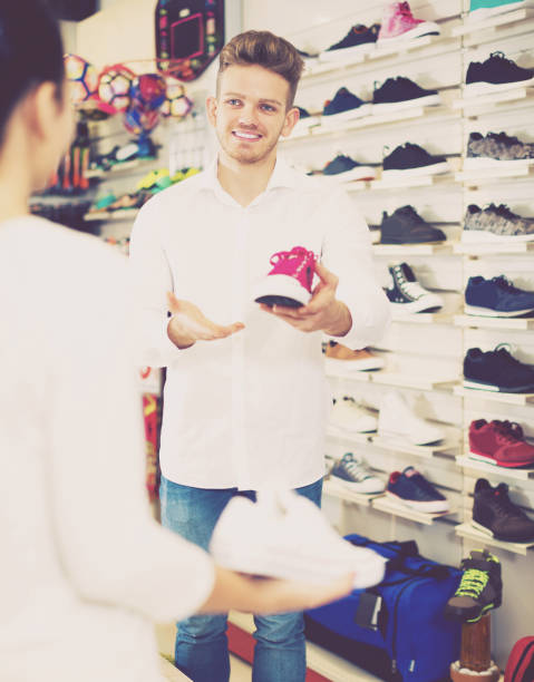 istock Male shop assistant helping customer 687152594