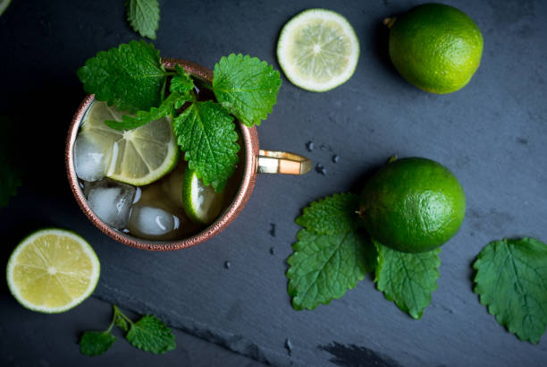 istock Cold Moscow Mule cocktail in copper mug on the rustic background 687156020