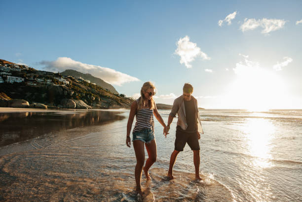 istock Happy young couple enjoying beach holidays 687157090