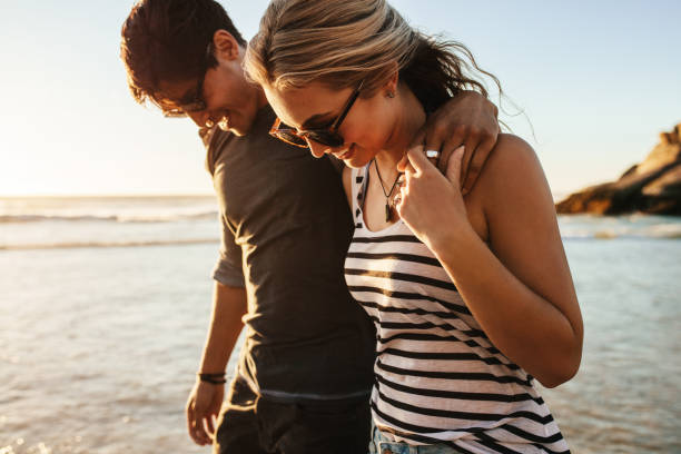 istock Happy young couple on beach holiday 687159220