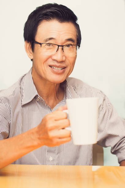 istock Closeup of Joyful Senior Asian Man Drinking Tea 687159550
