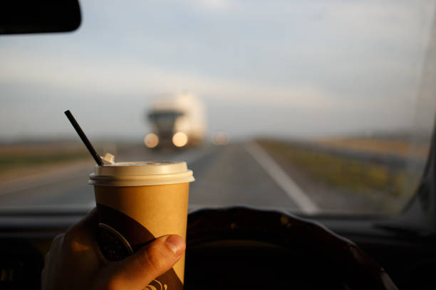 Drinking coffee while riding in the car. Emergency while eating at the wheel