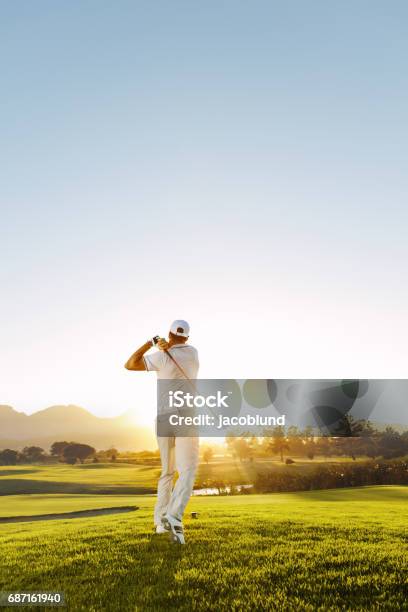 Young Man Playing Golf On A Sunny Day Stock Photo - Download Image Now - Golf, Golfer, Golf Course