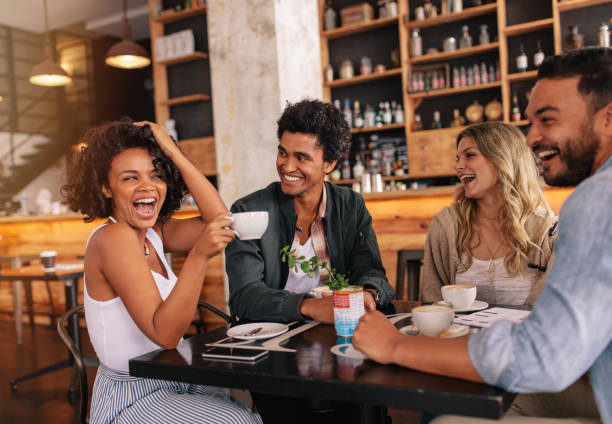istock Group of friends enjoying coffee together 687163420