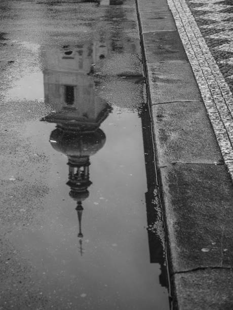 istock church in prague reflecting in a puddle on the street 687165564
