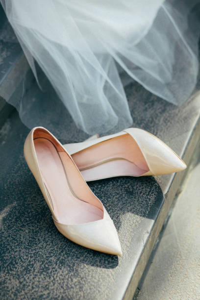 istock Beautiful white wedding shoes for brides 687166028