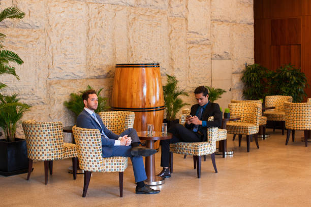 istock Two Middle-aged Business Men Relaxing in Cafe 687166454