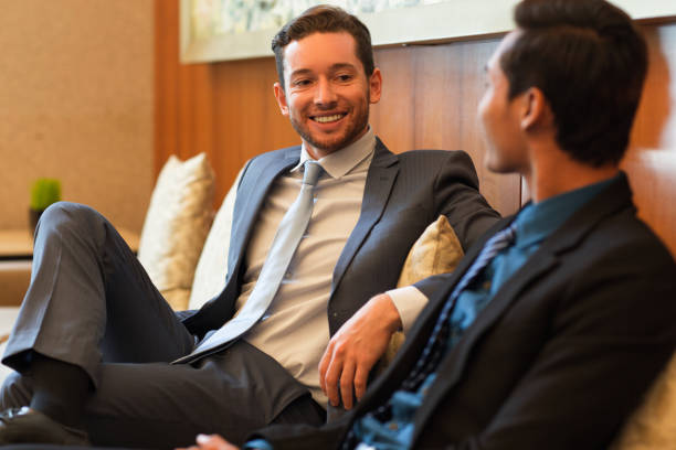 istock Two Smiling Business Men Chatting in Lounge 687166468