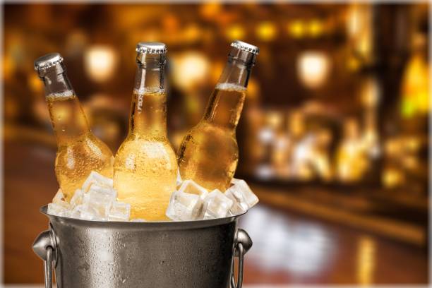 Beer. Bottles of cold and fresh beer with ice isolated beer bottle photos stock pictures, royalty-free photos & images