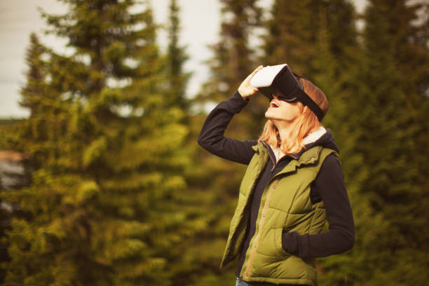 istock Young woman in virtual reality headsets 687170704