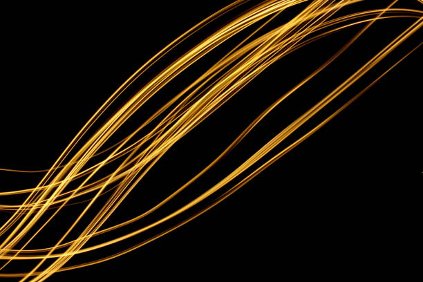 istock Gold Light Painting Photography against a black background 687173778