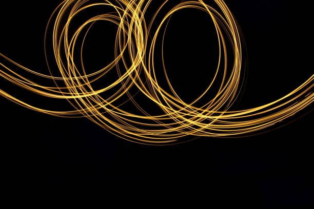 istock Gold Light Painting Photography against a black background 687173782