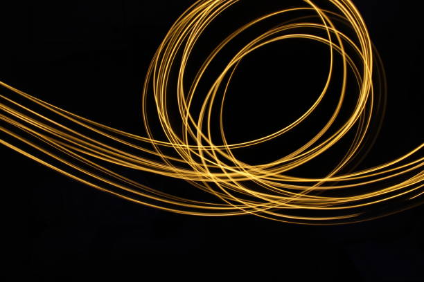 istock Gold Light Painting Photography against a black background 687174980