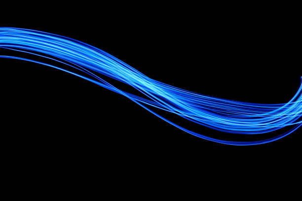 istock Blue Light Painting Photography, smooth line patterns against a black background 687180774