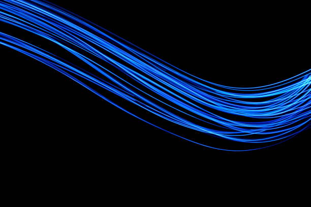istock Blue Light Painting Photography, smooth line patterns against a black background 687180816