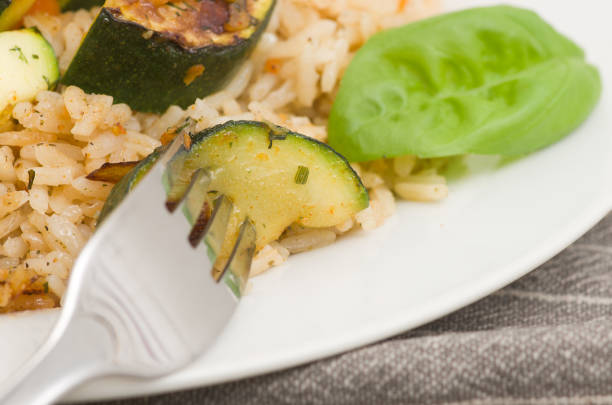 istock Risotto with grilled zucchini and vegetables. 687197902