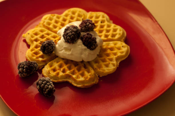 istock Belgian waffles with berries (currants, strawberries) and ice cream 687200216