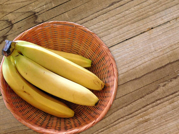 istock Bananas on wooden background 687203080