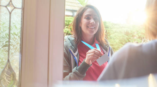 istock charity worker at the door 687210122
