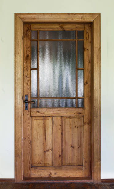 istock Brown wood old door with glass 687210526