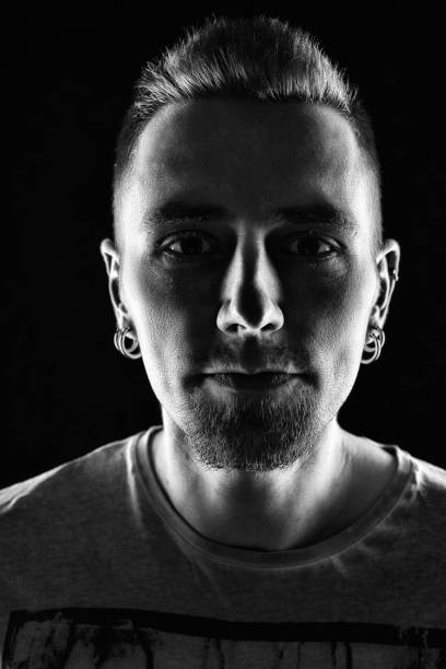 istock Portrait of a man with earrings 687213954