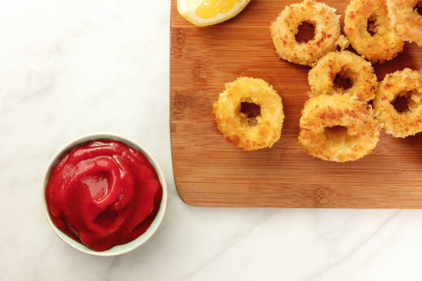 istock Calamari rings, red sauce, lemon, copyspace 687217006